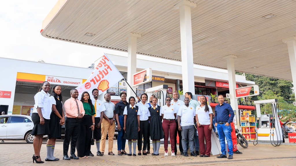 Vivo Energy Uganda MD Joanita Mukasa Menya (centre - in black) with staff and Shell customers at the launch of the 'Fuel Their Future' promotion.