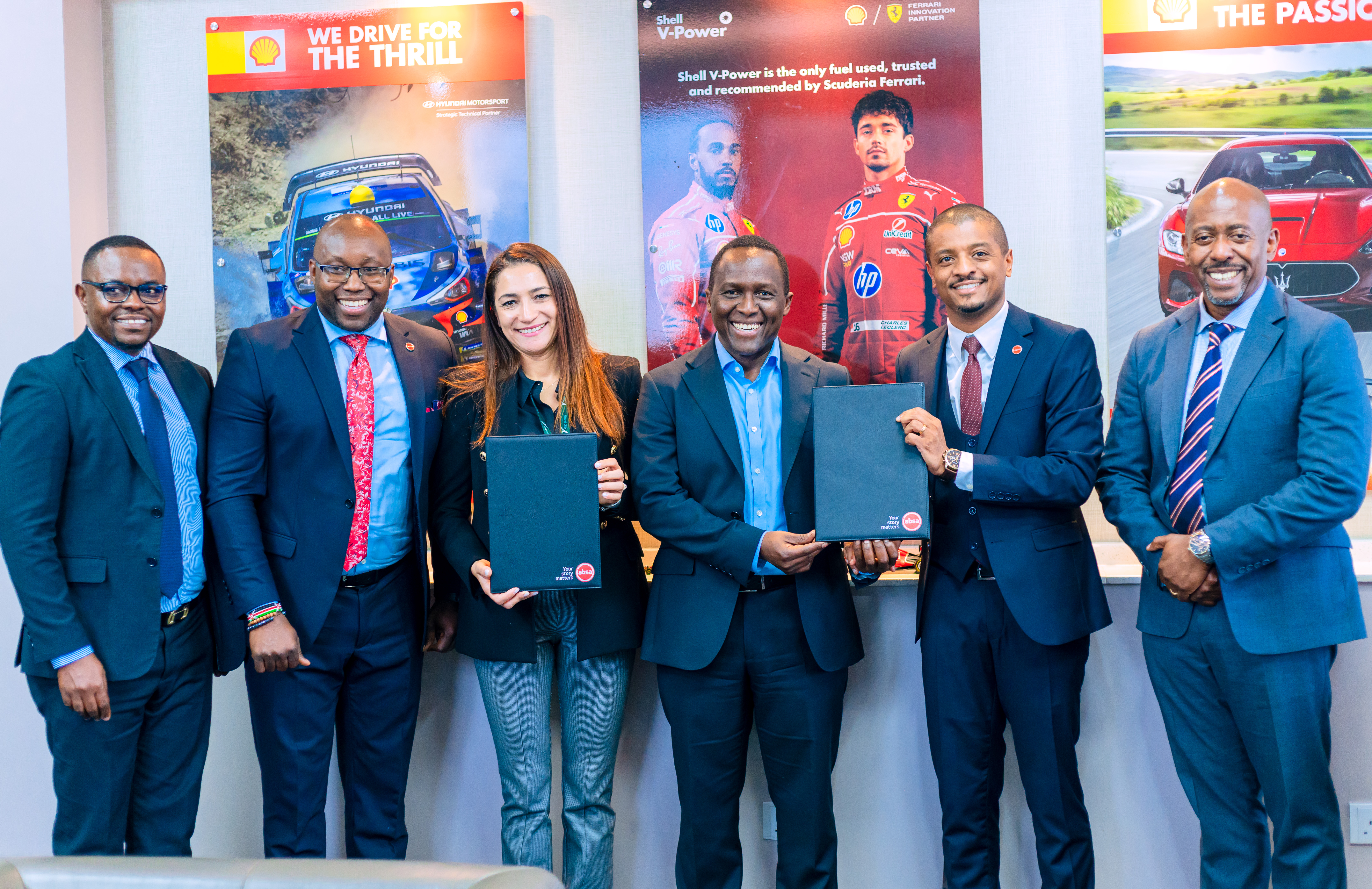 Six representatives from Absa Bank Kenya PLC and Vivo Energy Kenya 