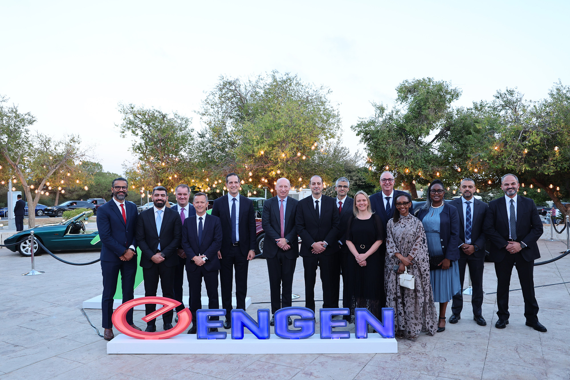 Representatives from Vivo Energy Jordan and the wider Group stand behind an Engen sign